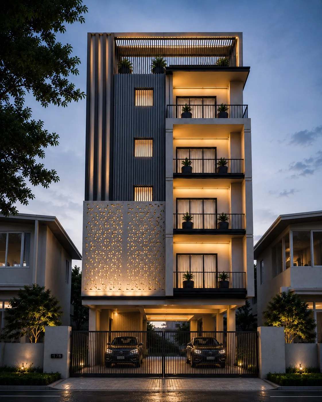 Dusk render of Advaay — a five-storey residential building with a glowing perforated jaali screen at its base, fluted grey cladding above, and lit balconies between neighbouring houses